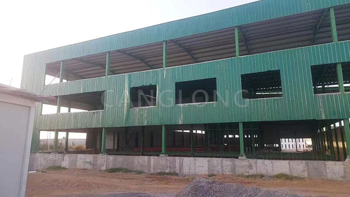 three-story steel factory building