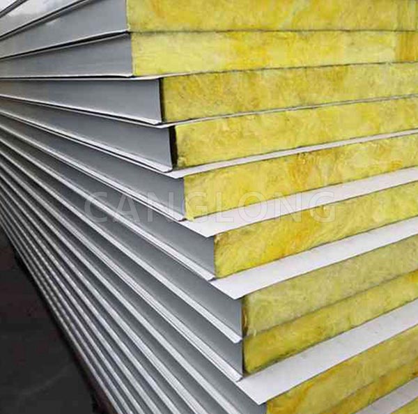 What are the advantages of using glass wool wall panels in warehouses?